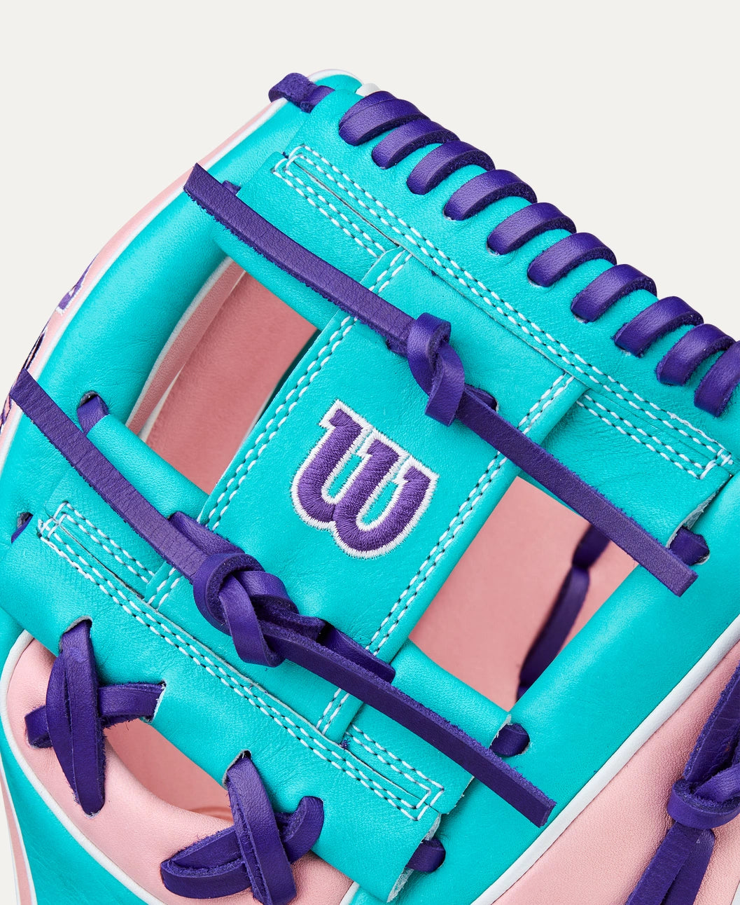 An 11.5” infield glove with Pink & Teal Pro Stock® Select leather for work at second base, third base or shortstop.