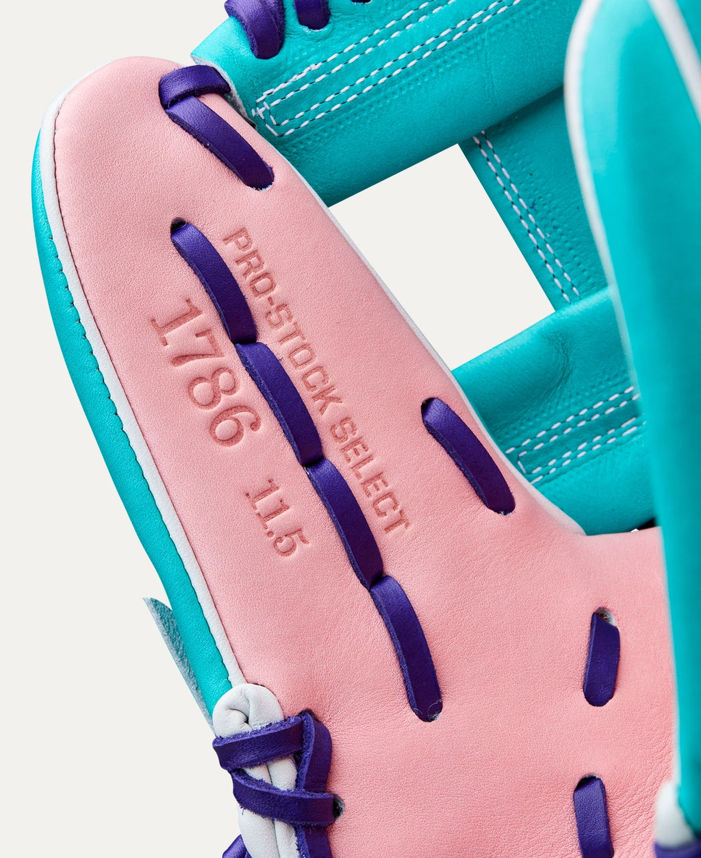 An 11.5” infield glove with Pink & Teal Pro Stock® Select leather for work at second base, third base or shortstop.