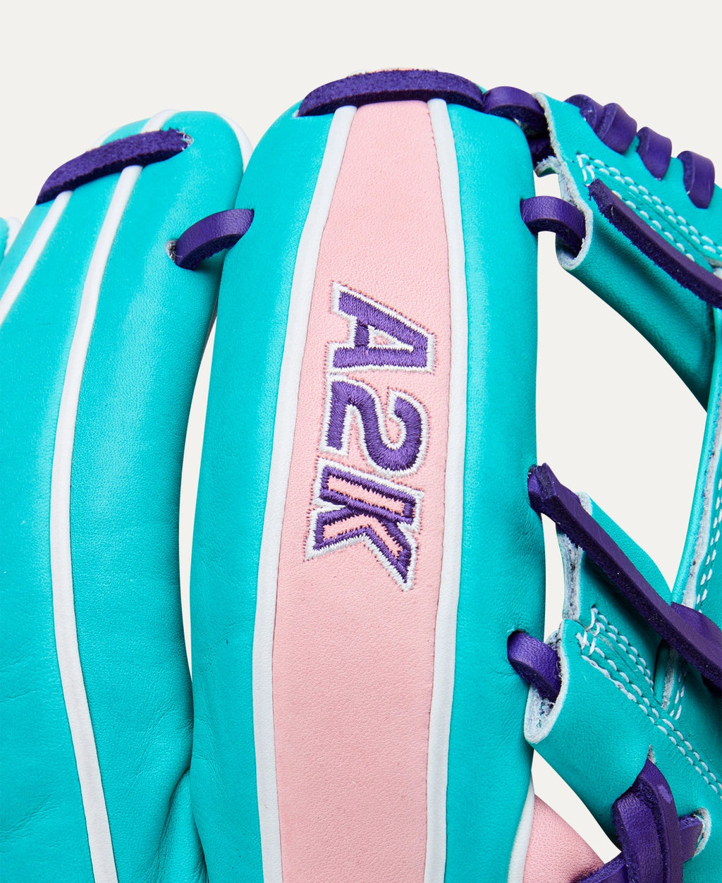 An 11.5” infield glove with Pink & Teal Pro Stock® Select leather for work at second base, third base or shortstop.